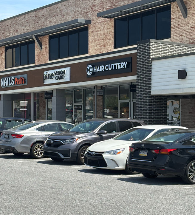 Hair Cuttery branded storefront awning with channel letters salon signage