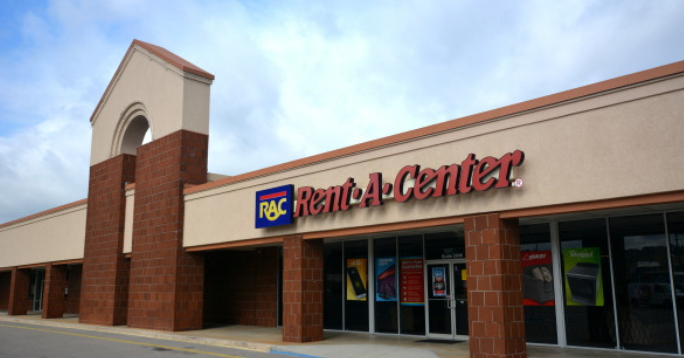 Rent-A-Center illuminated pylon sign multi-tenant retail center